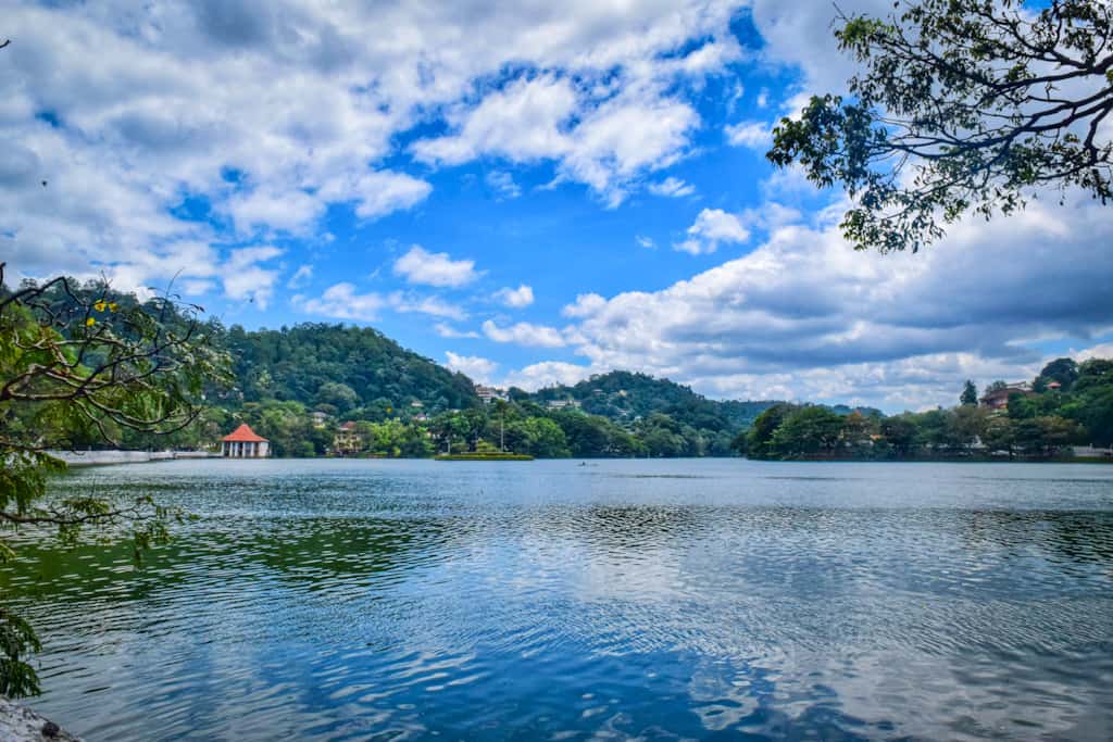 Clear blue lake surrounded by green hills sri Lanka Itinerary