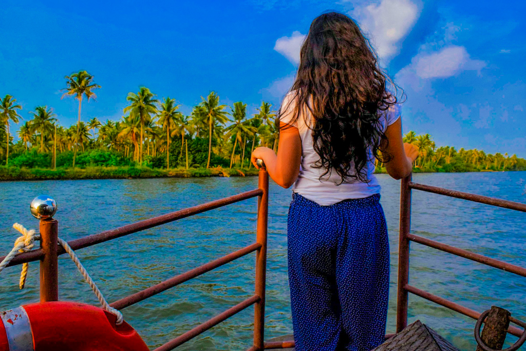 girl standing on a houseboat kerala itinerary