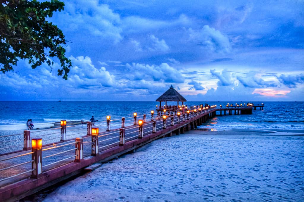 Twilight time on a beach with a boardway