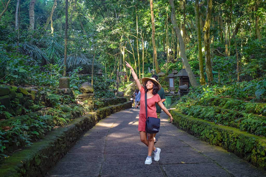 girl posing in a forest things to do in bali