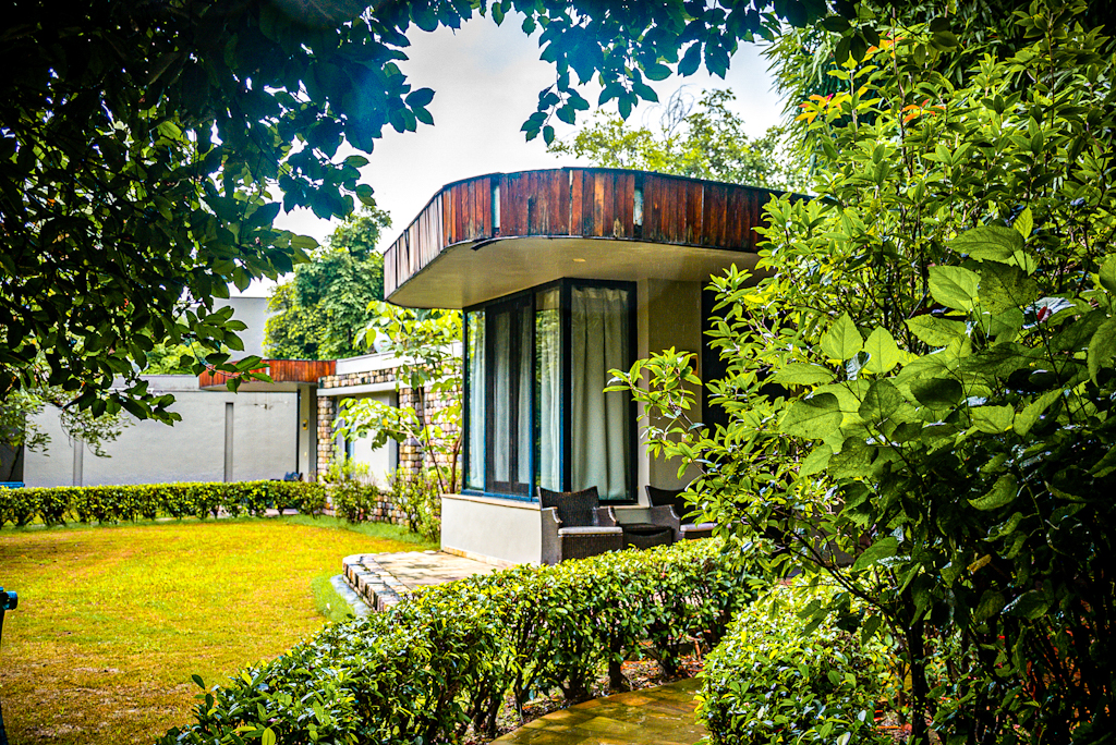 Exterior of a villa surrounded by trees golden tusk jim Corbett