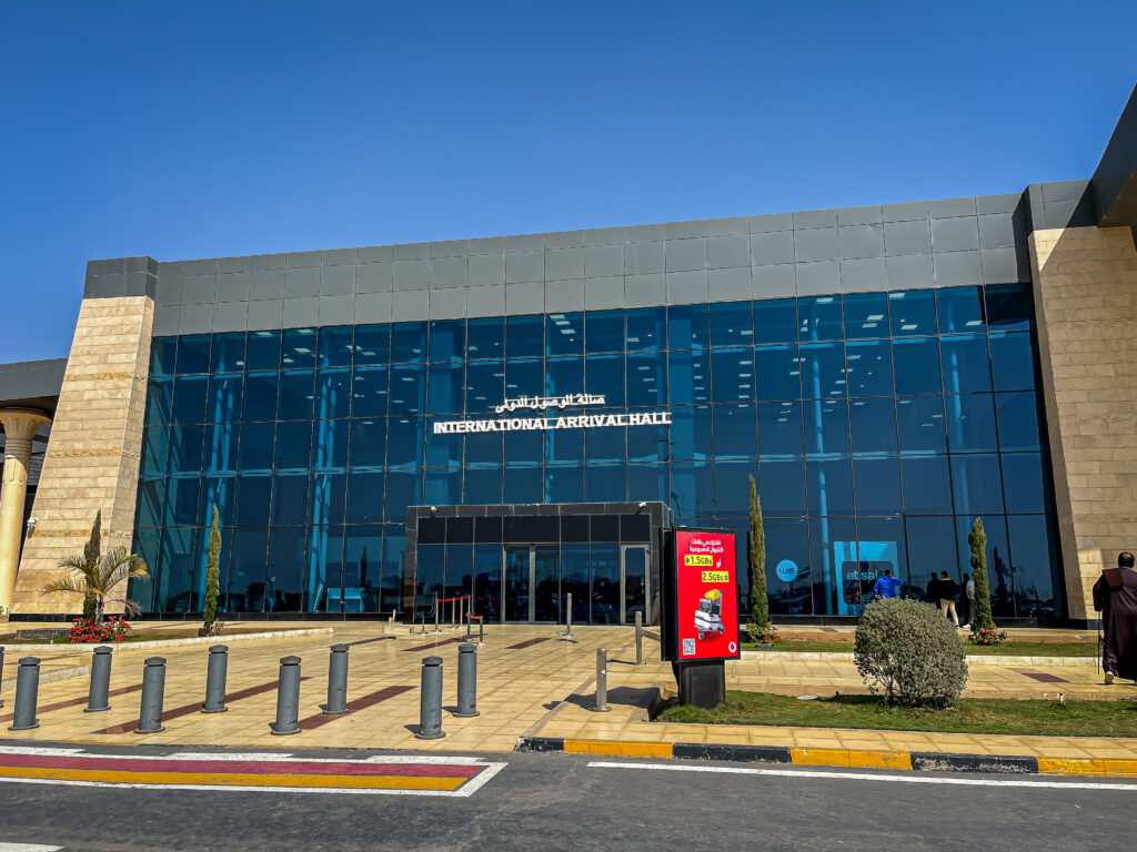 airport with international arrival hall written on it