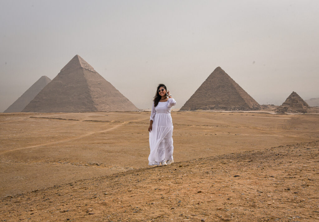 indian girl in front of pyramids is egypt safe to visit for women