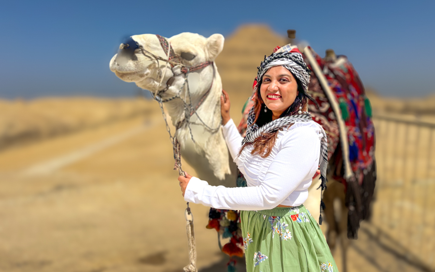 indian girl standing with a camel in front of a pyramid egypt visa for indians